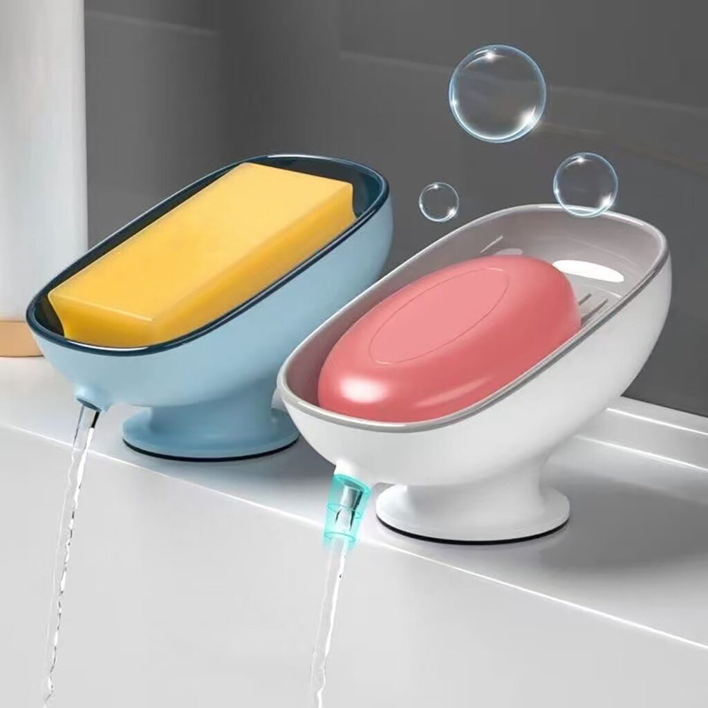 Blue and white self-draining soap dishes with suction bases